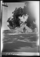 Hildegarde Flanner at the entrance to the cemetery at Mission San Luis Rey, Oceanside, 1927