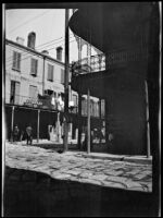 Building with a wrought iron balcony on Royal St. in the French Quarter, New Orleans, 1910