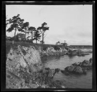 Shoreline houses on a rocky coastline, Monterey vicinity, 1900-1930