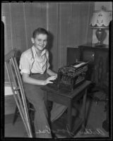 Edward Jacobsen sits at a typewriter and edits the school newspaper, Redlands, 1936