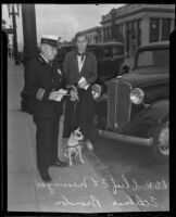 Ethelmae Brandon watches, as Chief E. L. Messinger of Hermosa Beach points out the parking regulations, Hermosa Beach, 1936