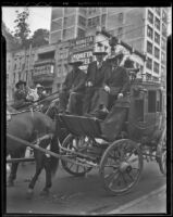 Governor Merriam, Governor Allred, and Buck Jones ride a horse drawn carriage, Los Angeles, 1936