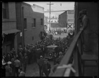 Crowd gathers at Ferguson Alley after gang shooting in Chinatown, Los Angeles, 1936
