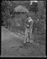Boy working in a home garden, Los Angeles, 1936