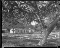 House beyond a wood rail fence on a small farm, Los Angeles County, 1936