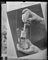 Hand-operated eggbeater beating an unknown liquid, 1936