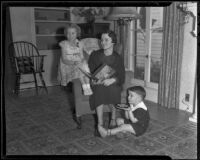 Mandane Lewis helps her two children Janet and Tommy with preparatory work, Los Angeles, 1936