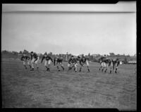Football players on the field, Los Angeles, 1938