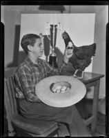 Jack Burns and his prize winning hen at the Great Western Livestock Show, Vernon, 1938