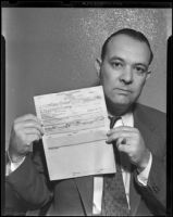Detective Lieutenant Jack Ellis holds the death certificate of Mildred Gross, Los Angeles, 1938
