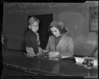 Mrs. Marjorie Storkan visits the tax office with her son, Oliver, Los Angeles vicinity, 1938