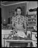 Nettie (Ma) Roten prepares a Thanksgiving turkey in her kitchen, Burbank, 1938