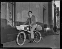 J. T. Fagg, Jr. poses on his bicycle during a cross-country trip from Seattle, Los Angeles vicinity, 1938