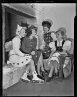 Virginia Nelson Parkin, Eleanor Harris, Myrna McMillan, and Christine Dailey model winter fashion, Los Angeles, 1938