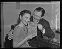 H. J. Isaacs and Beulah Kelley with a telephone book from 1899, Los Angeles, 1938