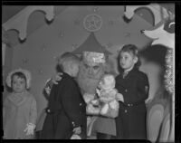 Santa Claus greets a few children, Los Angeles vicinity, 1938