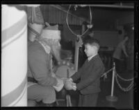 Boy visits with a Santa Claus, Los Angeles vicinity, 1938