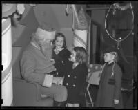 Three girls visit a Santa Claus, Los Angeles vicinity, 1938