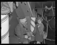 Shy girl visits Santa Claus, Los Angeles vicinity, 1938