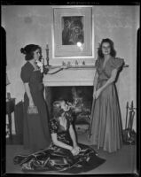 Barbara Spencer, Joan Pond, and Barbara Pond Schaefer in front of a fireplace, Pasadena, 1938