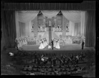 Coronation of Tournament of Roses queen Barbara Dougall by Lathrop K. Leishman at the Civic Auditorium, Pasadena, 1938