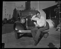Chauffeur Harry Mac Adams with the Los Angeles Times car, Los Angeles, 1935-1939