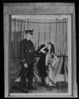 Captain Clem Peoples, Los Angeles County jailer, and child dancer Joyce Horne prepare for a benefit show, Los Angeles, 1934