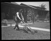 Lewis Patrick Phillips, former judge, mowing his lawn, Downey, 1922