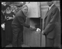 Mayor John C. Porter seals time capsule during building dedication, Los Angeles, 1932