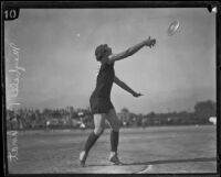 Maybelle Reichardt, Olympic track athlete, engaged in a discus throw, circa 1928-1932