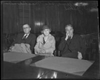 Ida Mae Rhoades, accused of the murder of Dr. George G. Hunter, in a courtroom with Luke J. McNamee and attorney W. I. Gilbert, Los Angeles, 1933