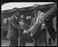 Theodore Douglas Robinson, Assistant Secretary of the Navy, greeted at train station, Los Angeles, 1925