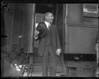 Theodore Douglas Robinson, Assistant Secretary of the Navy, upon his arrival at a train station, Los Angeles, 1925