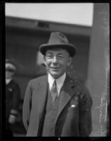 Theodore Douglas Robinson, Assistant Secretary of the Navy, arriving at a train station, Los Angeles, 1925