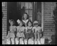 June Robles with unidentified children and a young woman, on a visit to see her relatives in Glendale, California, 1934