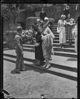 Myrtle St. Pierre, breach of promise plaintiff, holding a bouquet on the steps of the County Courthouse, Los Angeles, 1932