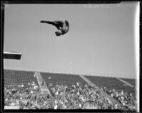 Farid Simaika, 1928 Olympic diver, in a pike position during the flight of a dive, between 1928-1929