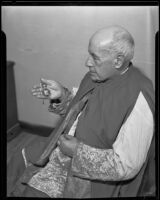 Monsignor Antonio M. Santandreu holding the cross of the Order of Isabella the Catholic, Los Angeles, 1934