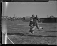 Russ Saunders and Ernie Nevers playing football at Wrigley Field, Los Angeles, circa 1932
