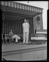 Norbert Savay, attorney, speaking on an outdoor stage, Los Angeles, 1931