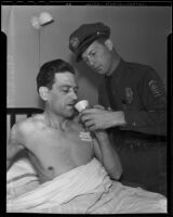 Charles Thompson, police ambulance driver, is given solace by Jack Needham, another driver, Los Angeles, 1935