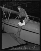 Frank Kurtz, aviator, seated on his plane "Yankee Boy," Los Angeles, 1935