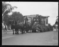 Horse-drawn float in the Old Spanish Days Fiesta parade on State Street, Santa Barbara, 1935
