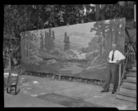 Jack Wilkinson Smith in front of a large landscape canvas at his studio, Alhambra, 1935