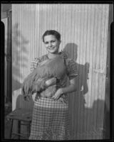 Florence DuPlessis holding a Buff Orpington rooster at the Southern California Poultry Show, Van Nuys, 1935