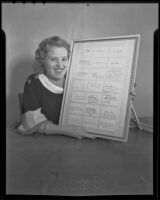 Louise Peterson points to a collection of autographs of military leaders who were prominent during World War I, El Segundo, 1935