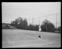 Helen Jacobs, tennis champion, on a tennis court, circa 1928