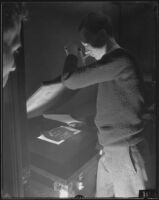 Photographer or technician creating a contact print, Los Angeles, 1935