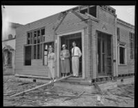 Reverend George A. Warmer Jr., Ruby Wilcox, and Naomi Lemon stand in front of their former church which they were converting into a parsonage, Burbank, 1935