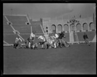 Football game between the UCLA Bruins and a Washington team at the Coliseum, Los Angeles, 1923-1939